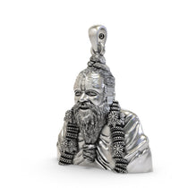 An angled profile view of the 925 silver Premanand Ji Maharaj pendant, highlighting its polished finish and durable build.