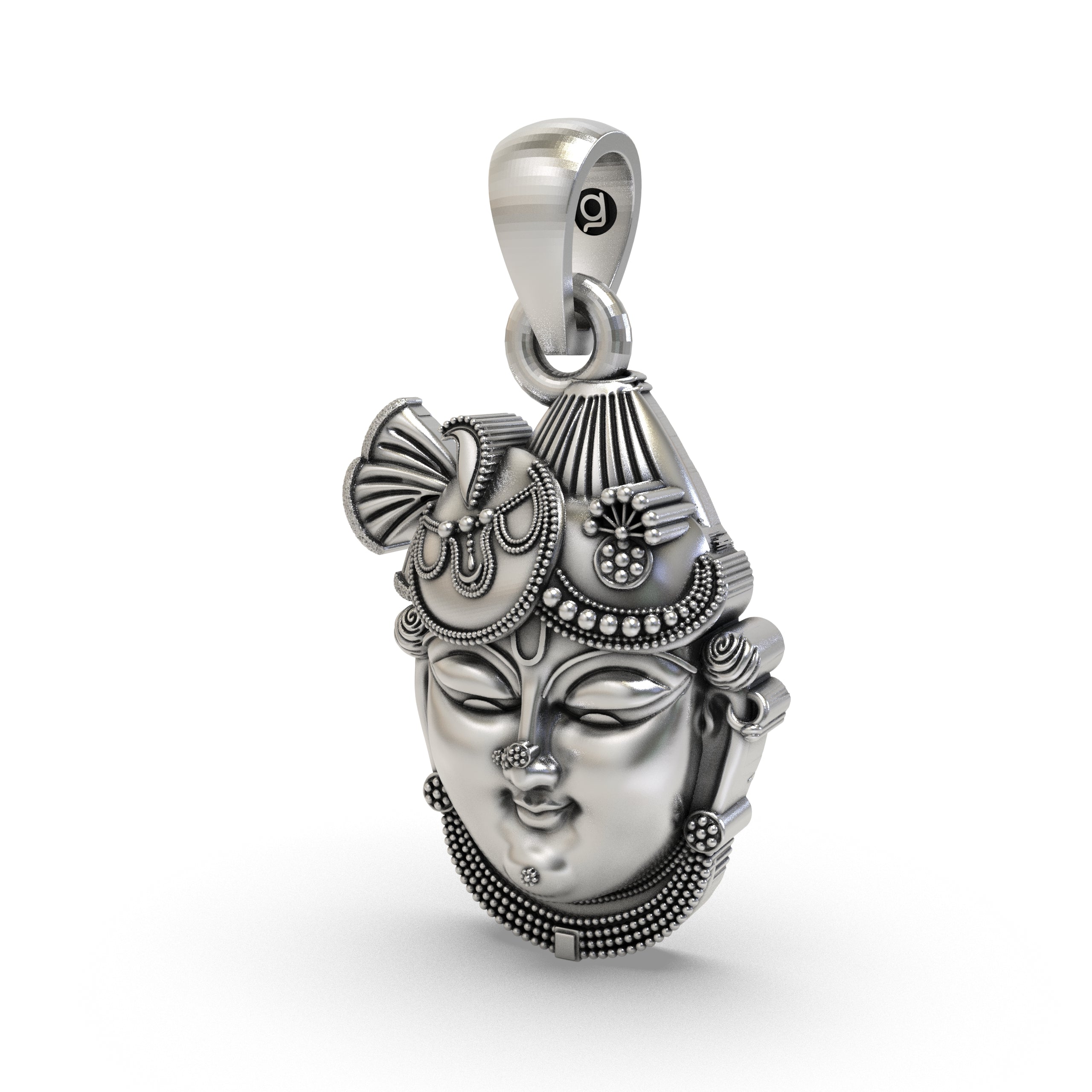 The sterling silver Shrinathji Krishna pendant held in hand to show its divine form, size, and lightweight design.