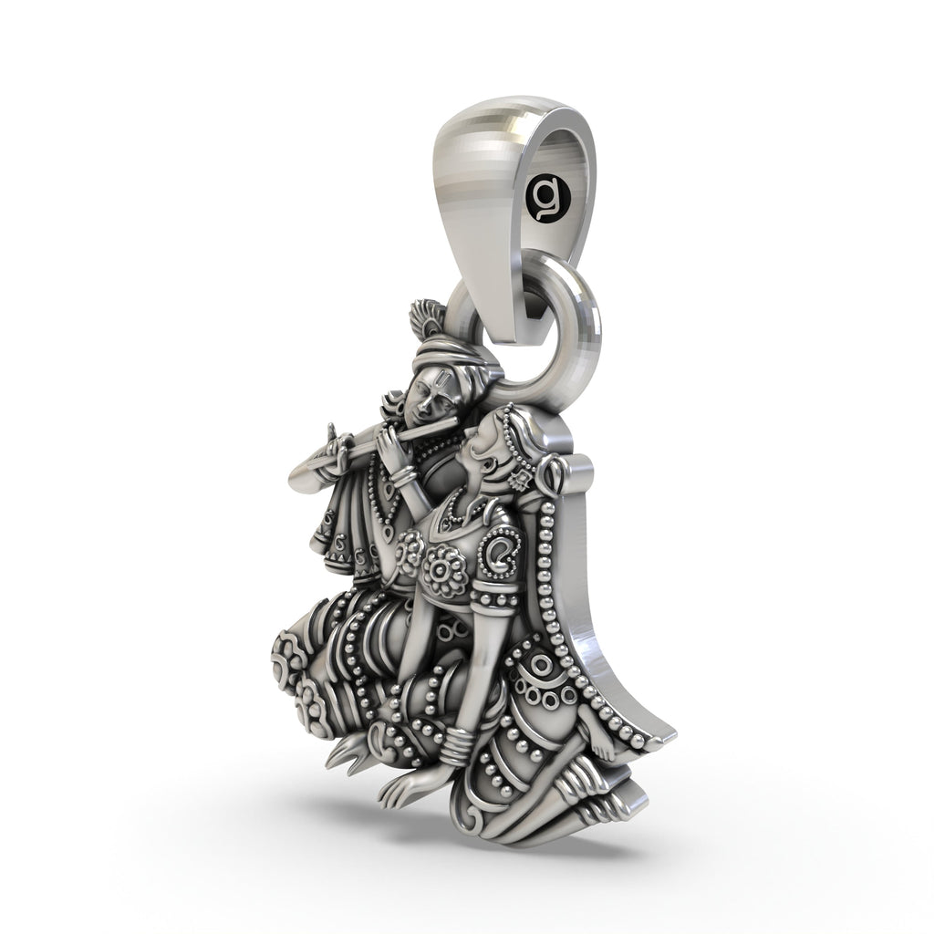 A close-up shot of the Radha Krishna pendant in 925 sterling silver, highlighting the intricate craftsmanship.