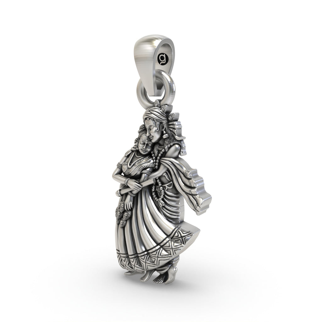 Angled close-up of the Radha Krishna silver pendant, highlighting the intricate details and antique oxidized look.