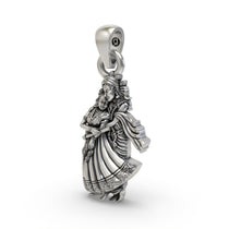Angled close-up of the Radha Krishna silver pendant, highlighting the intricate details and antique oxidized look.