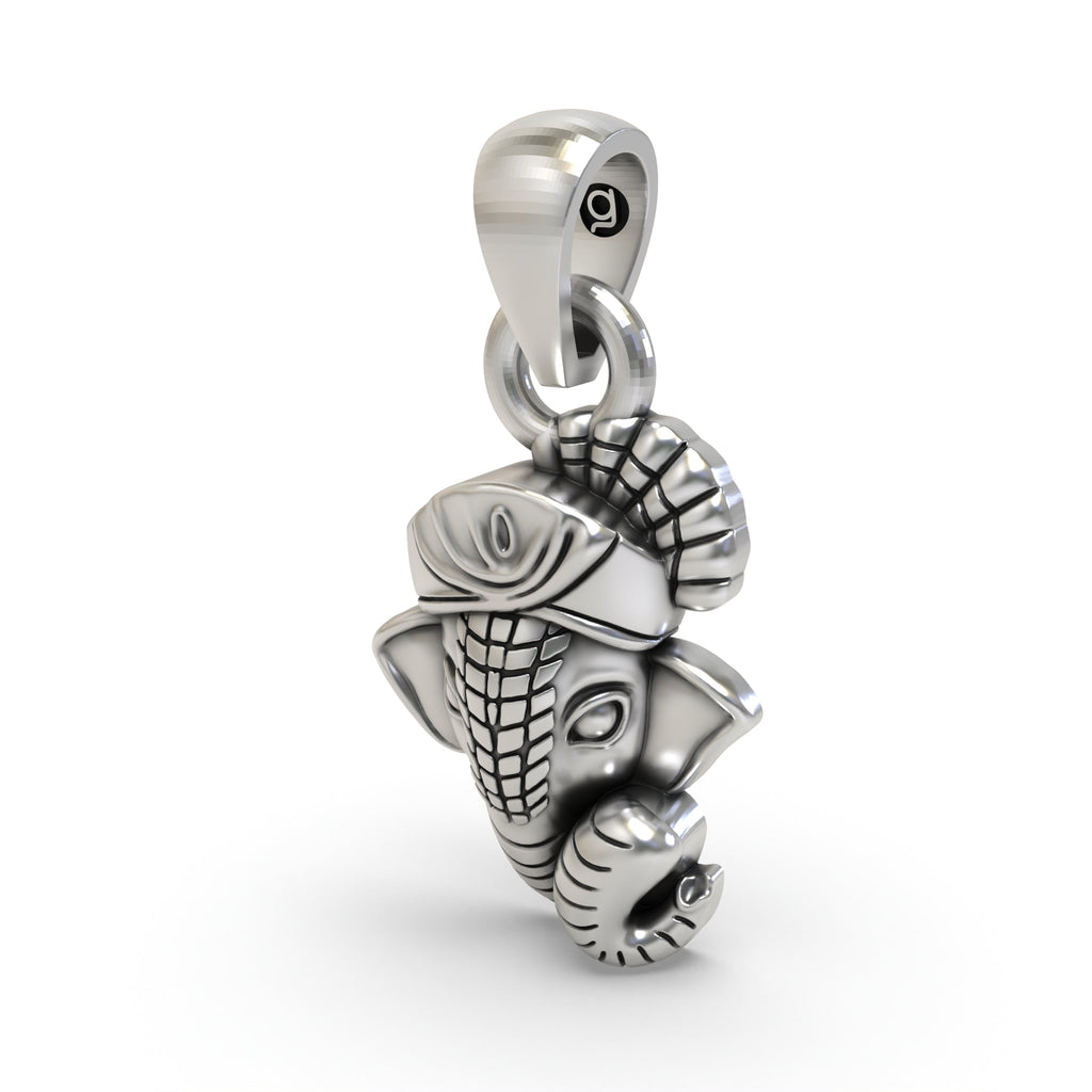 The Ganesha Face 925 Silver Pendant from a side profile, emphasizing the oxidized silver texture and hollow back design.