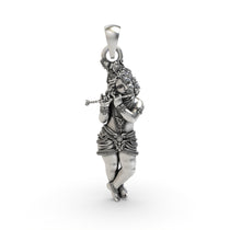 Front view of the 925 sterling silver Krishna pendant, showing the Lord playing a flute with an antique oxidized finish.
