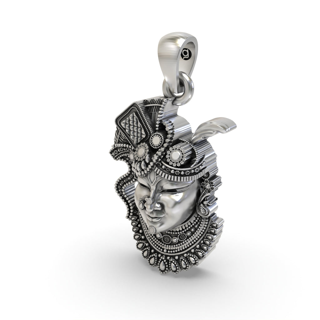 The 925 silver Shrinathji face pendant shown from a different angle to display its hollow back design for comfort.