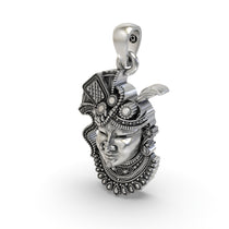 The 925 silver Shrinathji face pendant shown from a different angle to display its hollow back design for comfort.