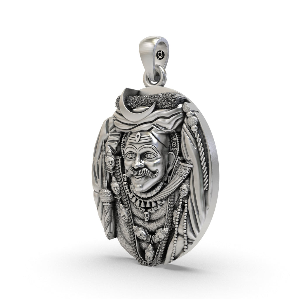 Angled view of the Lord Kaal Bhairav amulet, highlighting the intricate details and oxidized 925 silver finish.
