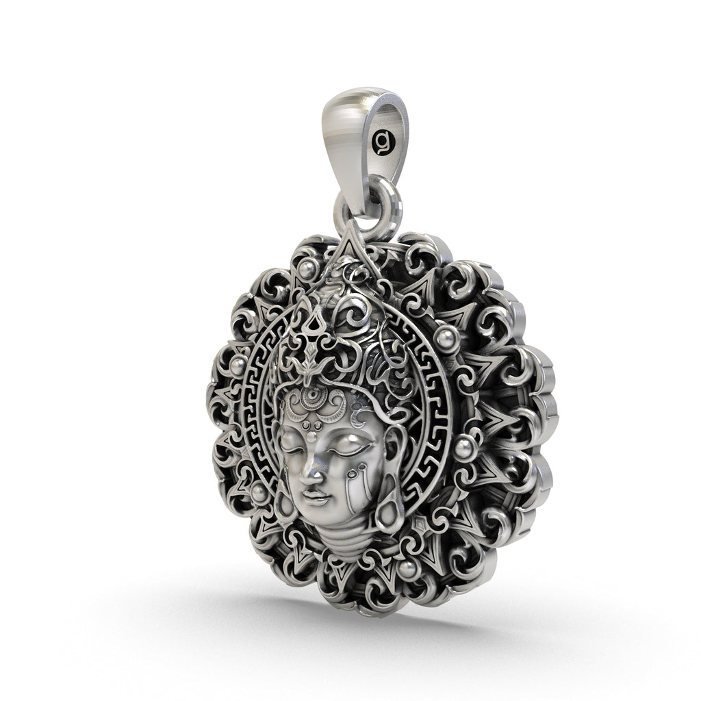 Angled side view of the sterling silver Buddha face pendant, showcasing the detailed craftsmanship and hollow back design.