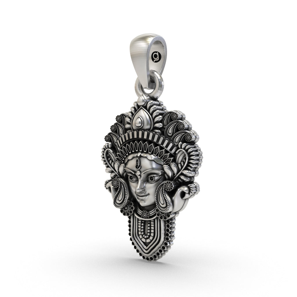 An angled profile of the oxidized 925 silver Durga Maa face pendant, highlighting its divine and powerful design for