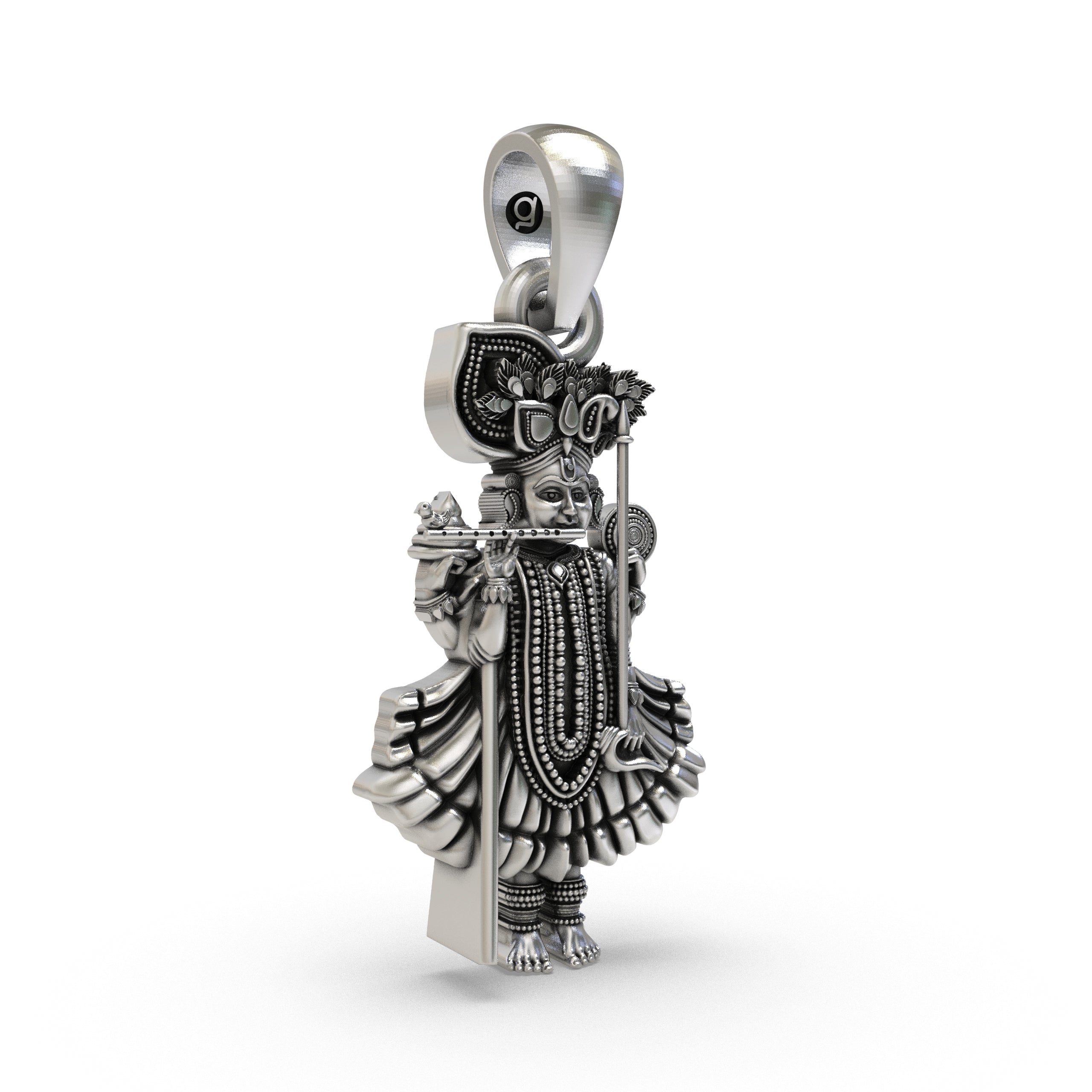 Angled side profile of the Dakor Krishna Ranchhodraiji silver pendant, revealing its depth and antique oxidized finish.