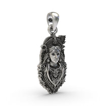 Detailed close-up of the Bal Krishna silver locket, showcasing the craftsmanship and antique oxidized finish.