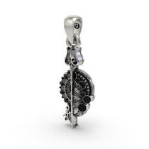 The 925 silver Maa pendant for protection shown against a neutral background to highlight its size.