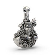Close-up of the antique oxidized finish on the sterling silver Shivji face amulet, showing its texture and depth.