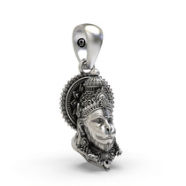 A close-up of the antique oxidized finish on the sterling silver Lord Hanuman pendant, showing intricate details.