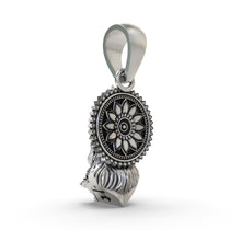 The devotional 925 silver Hanumanji face pendant shown with a chain to illustrate how it is worn for protection.