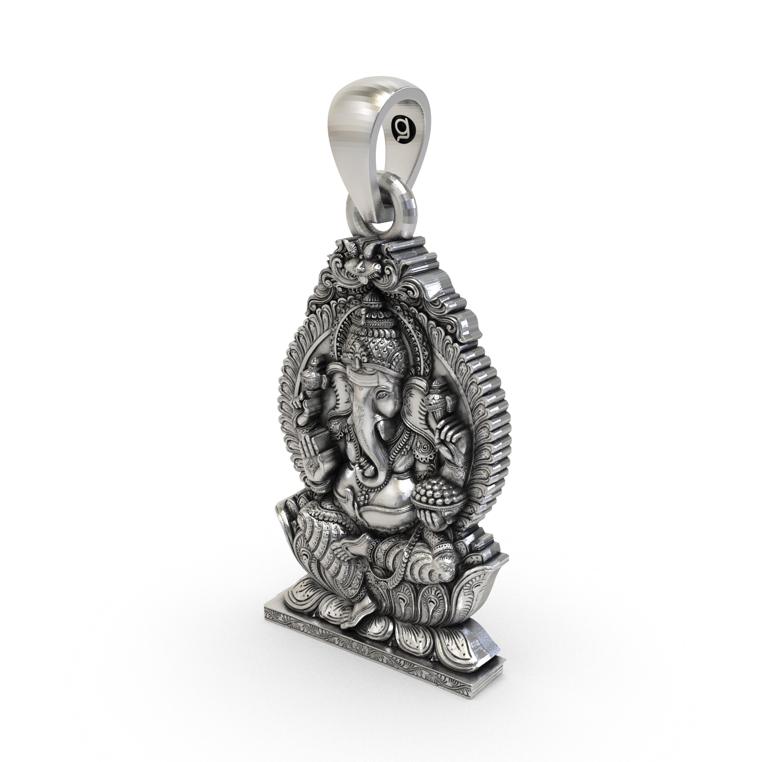 A close-up of the handmade sterling silver Ganesha pendant held in hand to show its size and detailed oxidized texture.