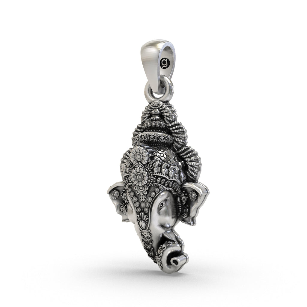 Close-up detail of a handcrafted 925 silver Lord Ganesha head pendant, showing the intricate carving and oxidized finish.