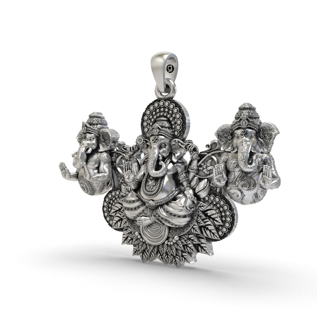 A close-up angled shot of the Three Ganesha Pendant, highlighting the oxidized 925 silver finish and craftsmanship.