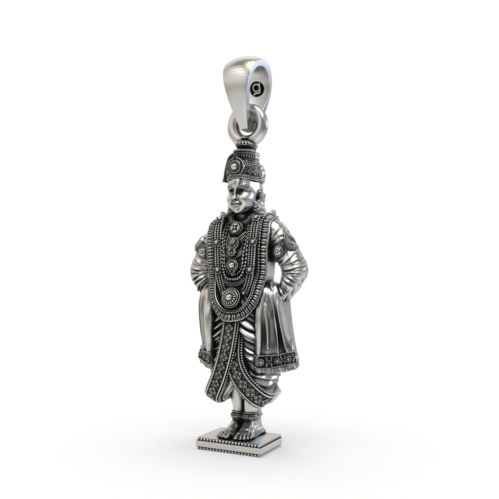 An angled perspective of the oxidized 925 silver Lord Vitthal pendant, highlighting its divine profile.