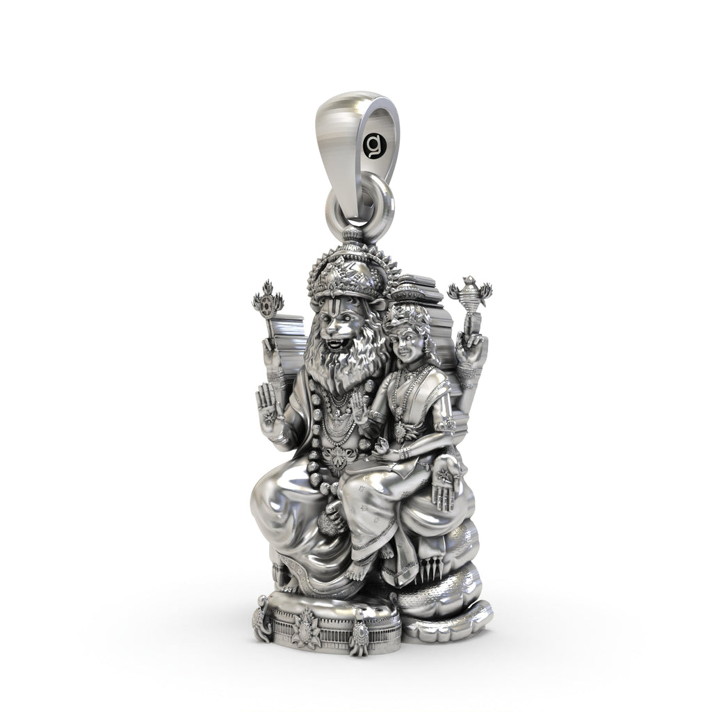 Close-up detail of the handmade Lakshmi Narasimha silver pendant showing intricate carvings.