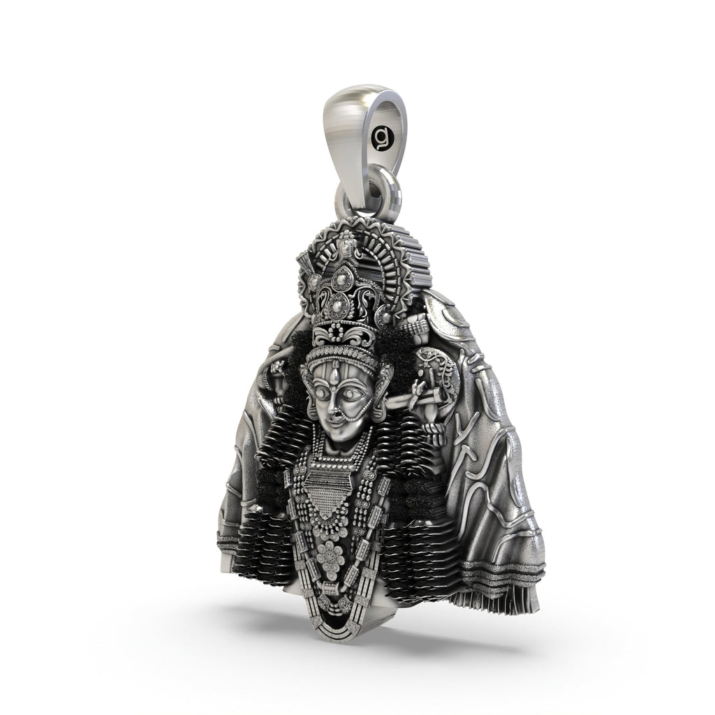Close-up of the handcrafted 925 sterling silver Ashapura Maa goddess pendant showing fine carvings.