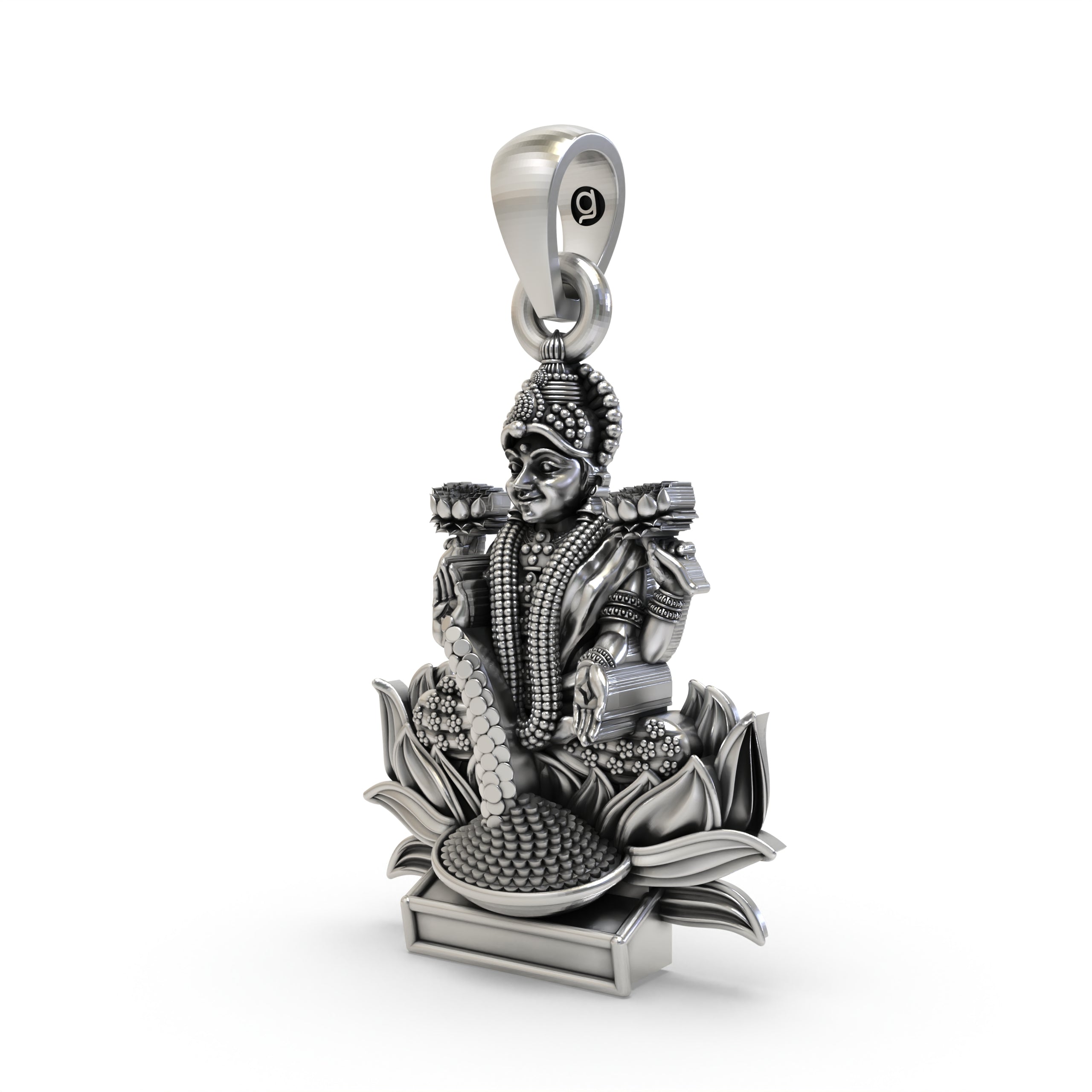 The sterling silver Lakshmi Maa pendant shown for size reference, a perfect spiritual keepsake for prosperity.