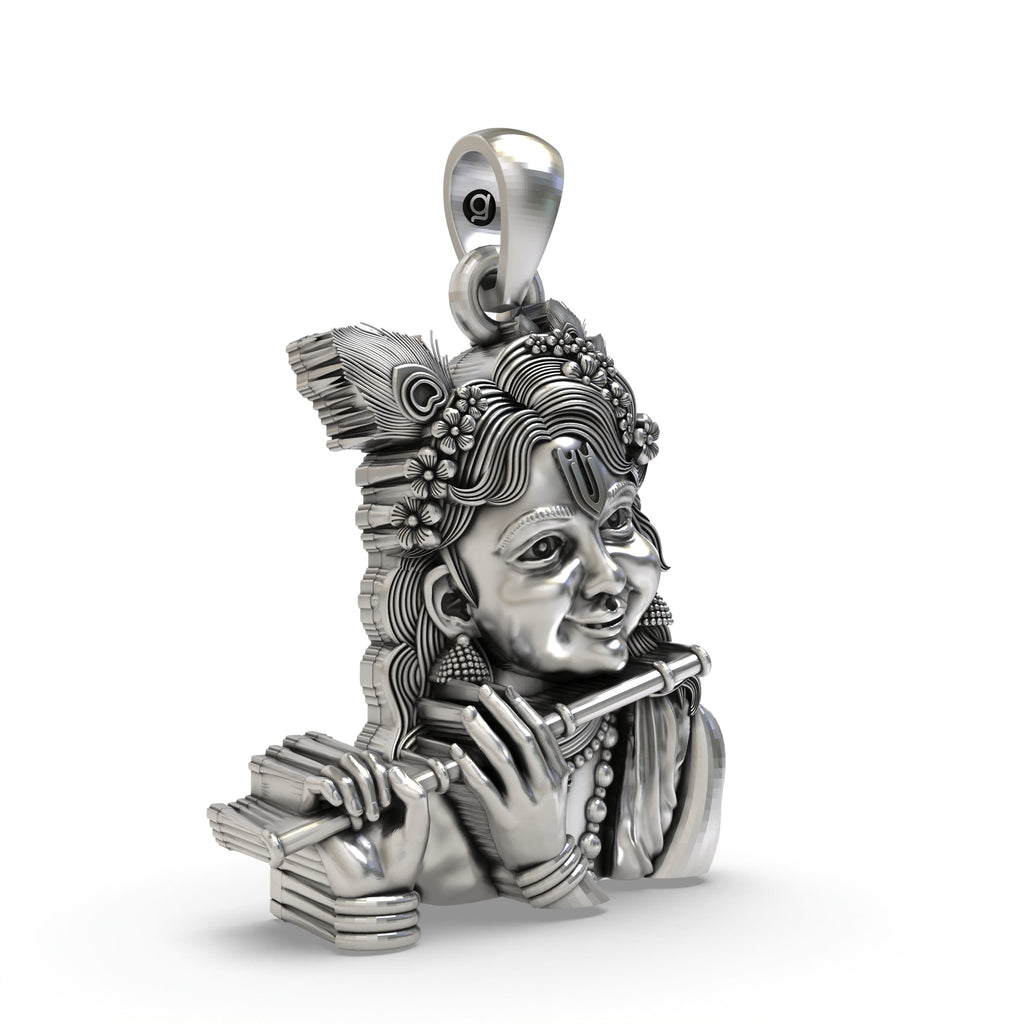 Close-up detail of the Bal Krishna pendant, focusing on the joyful facial expression and polished 925 silver finish.