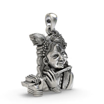 Close-up detail of the Bal Krishna pendant, focusing on the joyful facial expression and polished 925 silver finish.