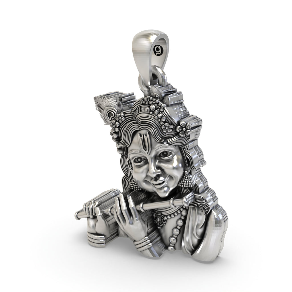 Side profile of the sterling silver Bal Krishna pendant, showcasing its depth and the fine handmade detailing.