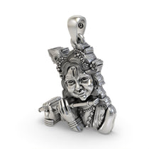 Side profile of the sterling silver Bal Krishna pendant, showcasing its depth and the fine handmade detailing.