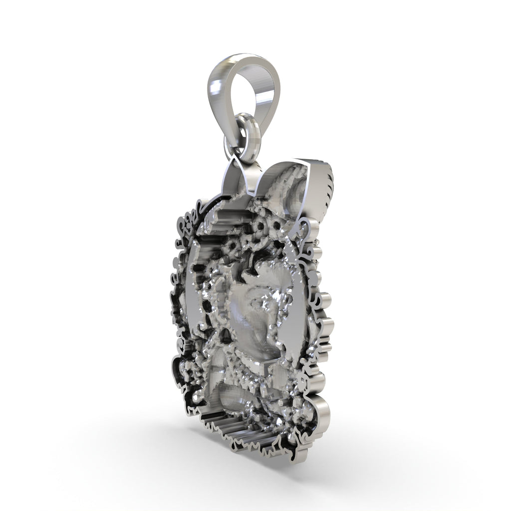 Top view of the Bal Krishna face pendant in sterling silver, displaying the sturdy bail for chain attachment.
