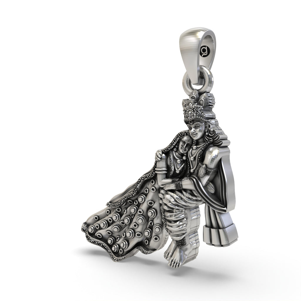 An angled profile of the spiritual Radha Krishna pendant, highlighting the detailed craftsmanship in pure 925 silver.