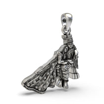 Close-up detail on the Hindu god Radha Krishna silver pendant, focusing on the intricate carvings of their attire.