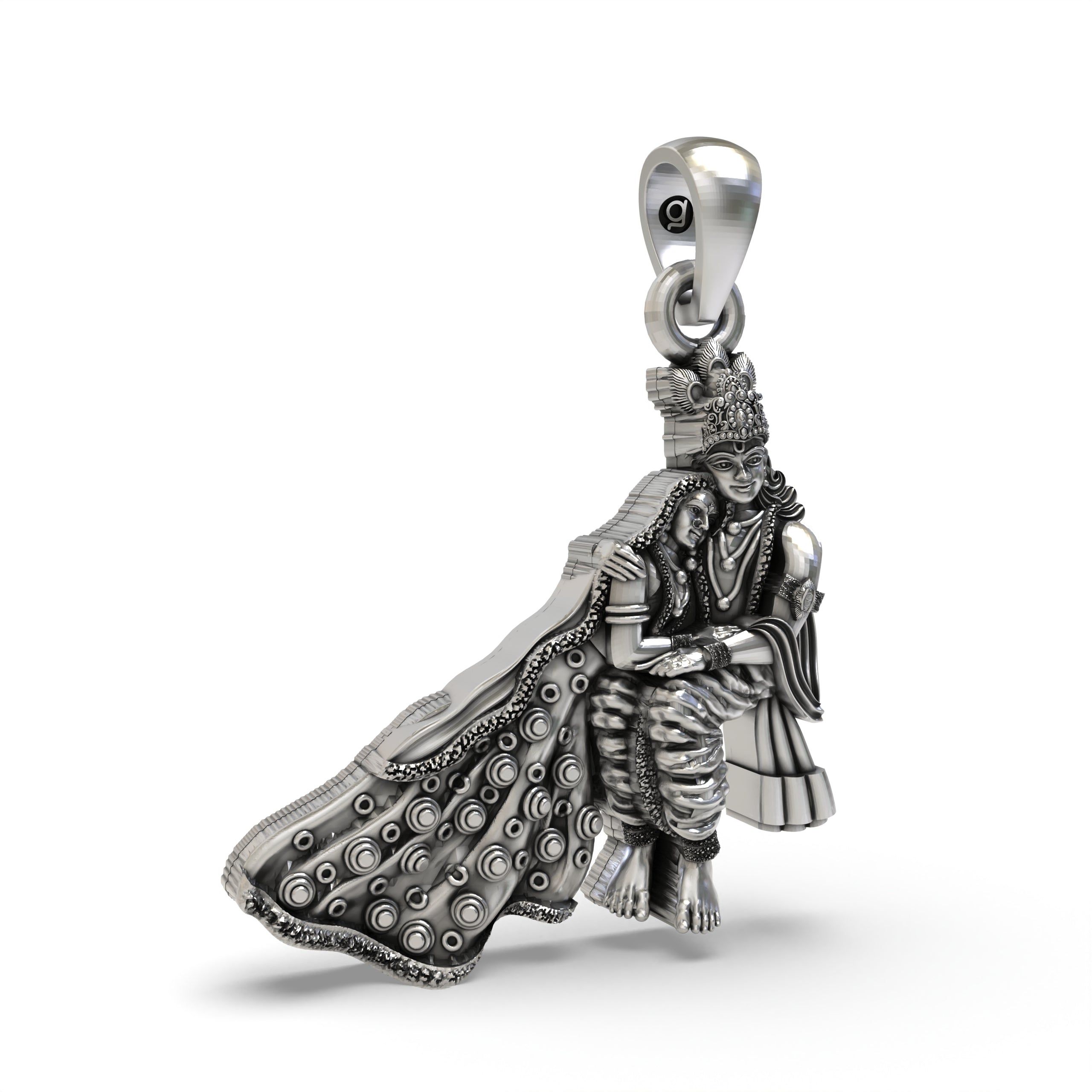 Close-up detail on the Hindu god Radha Krishna silver pendant, focusing on the intricate carvings of their attire.