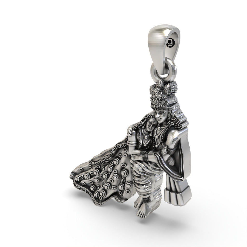 The back of the 925 sterling silver Radha Krishna pendant, showing the smooth polished finish and sturdy pendant bail.