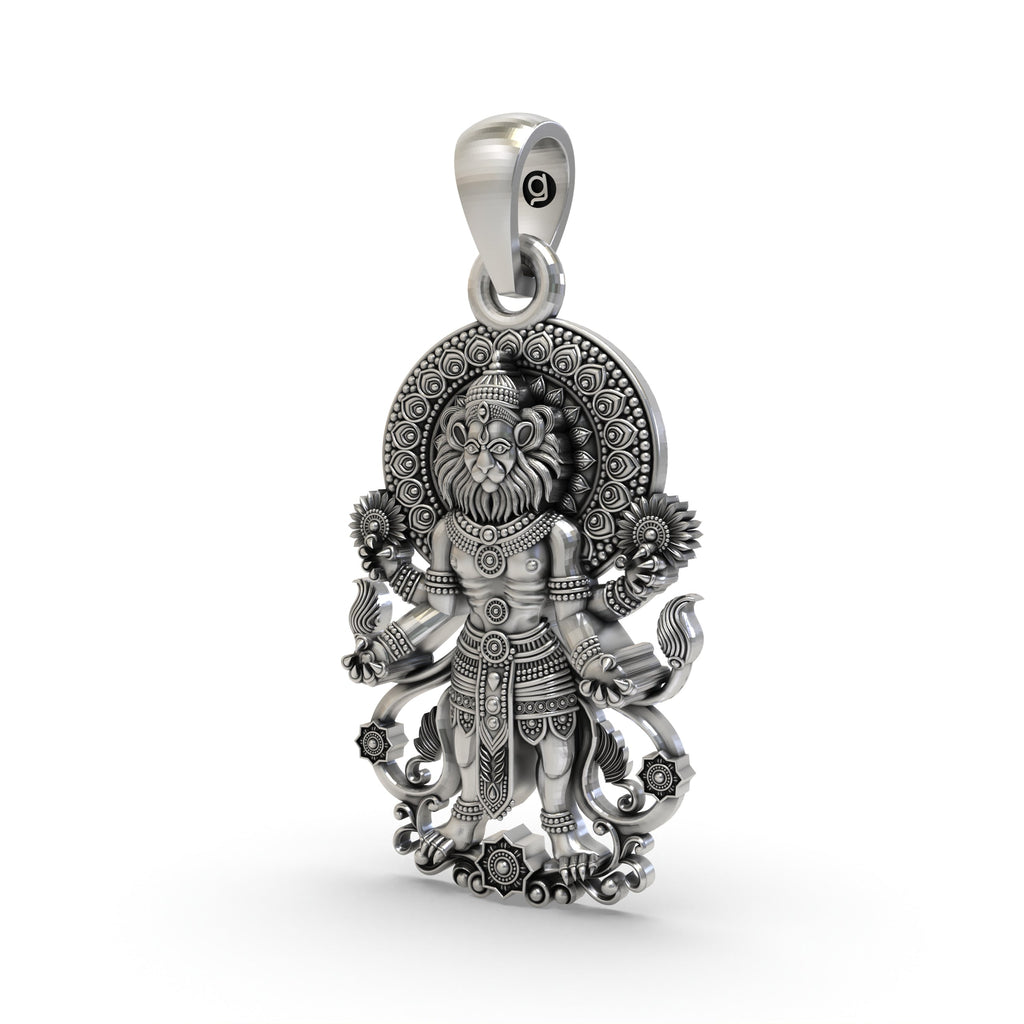A close-up of the Lord Narasimha silver pendant, highlighting the fine, handcrafted details of the deity's face.
