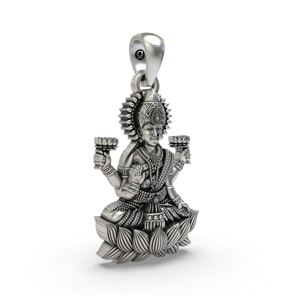 A close-up view of the Lakshmi Maa silver pendant, showcasing the fine craftsmanship of the goddess's form.