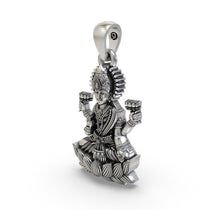 The sterling silver Lakshmi Maa pendant shown against a scale to display its 31mm size and beautiful finish.