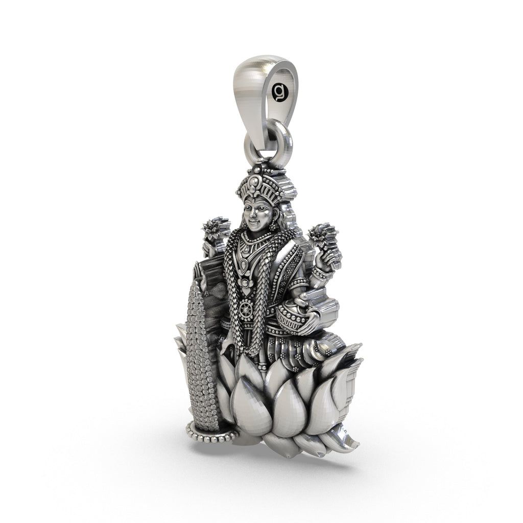 Angled profile of the Lakshmi Maa silver pendant, highlighting the intricate temple-style craftsmanship.