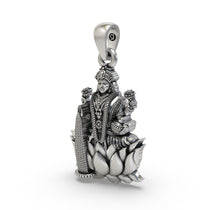 Angled profile of the Lakshmi Maa silver pendant, highlighting the intricate temple-style craftsmanship.