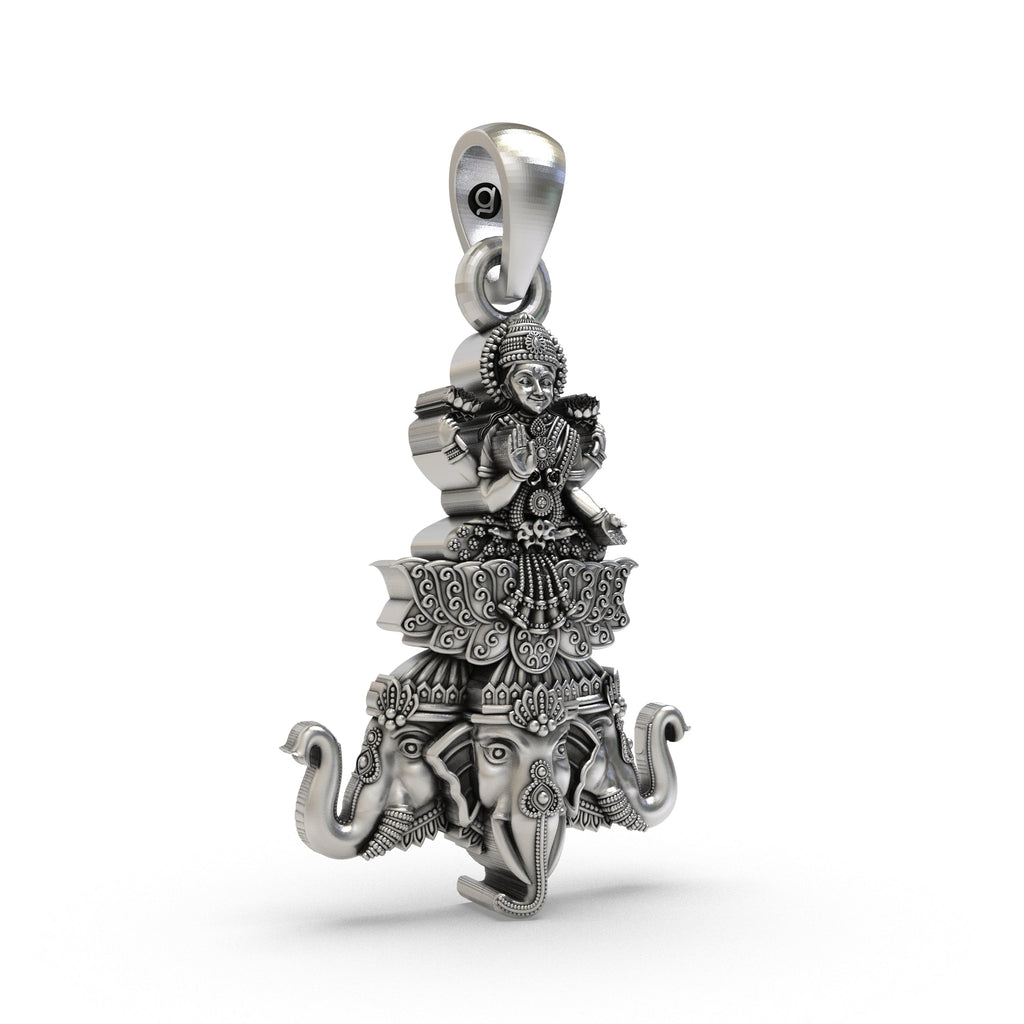 Close-up detail of Goddess Lakshmi on the divine elephant Airavata on a sterling silver spiritual pendant.