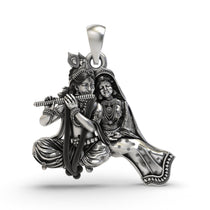 Front view of the handcrafted Radha Krishna silver pendant, showing Lord Krishna playing the flute in 925 sterling silver.