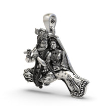 A detailed close-up of the Radha Krishna silver pendant, highlighting the intricate temple-style artistry and craftsmanship.