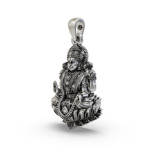 Close-up detailing of the Mahalakshmi silver pendant showing intricate antique oxidized finish and carving.