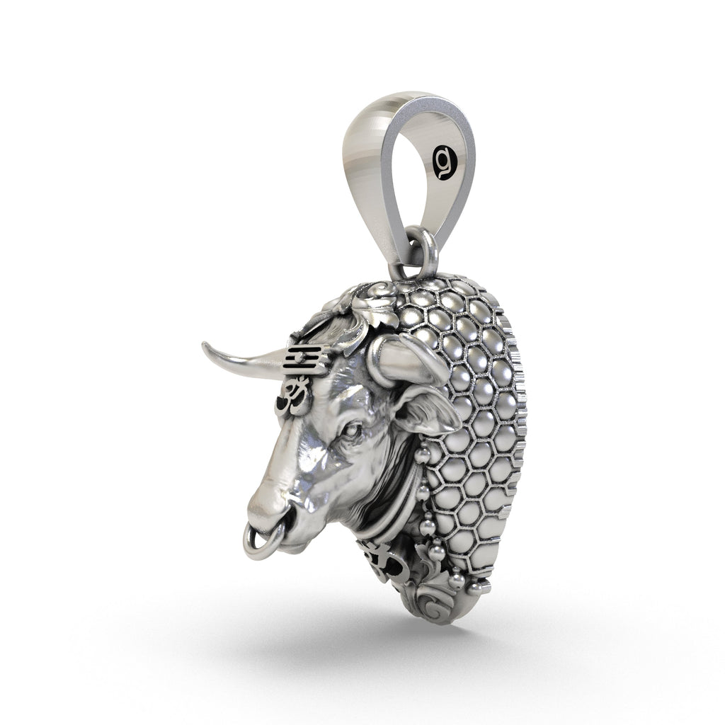 Close-up detail of handcrafted sterling silver Nandi pendant highlighting the temple-style finish.