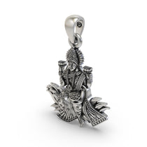 The 925 sterling silver Lakshmi Maa lotus pendant with an oxidized finish, emphasizing its traditional, handmade appeal.