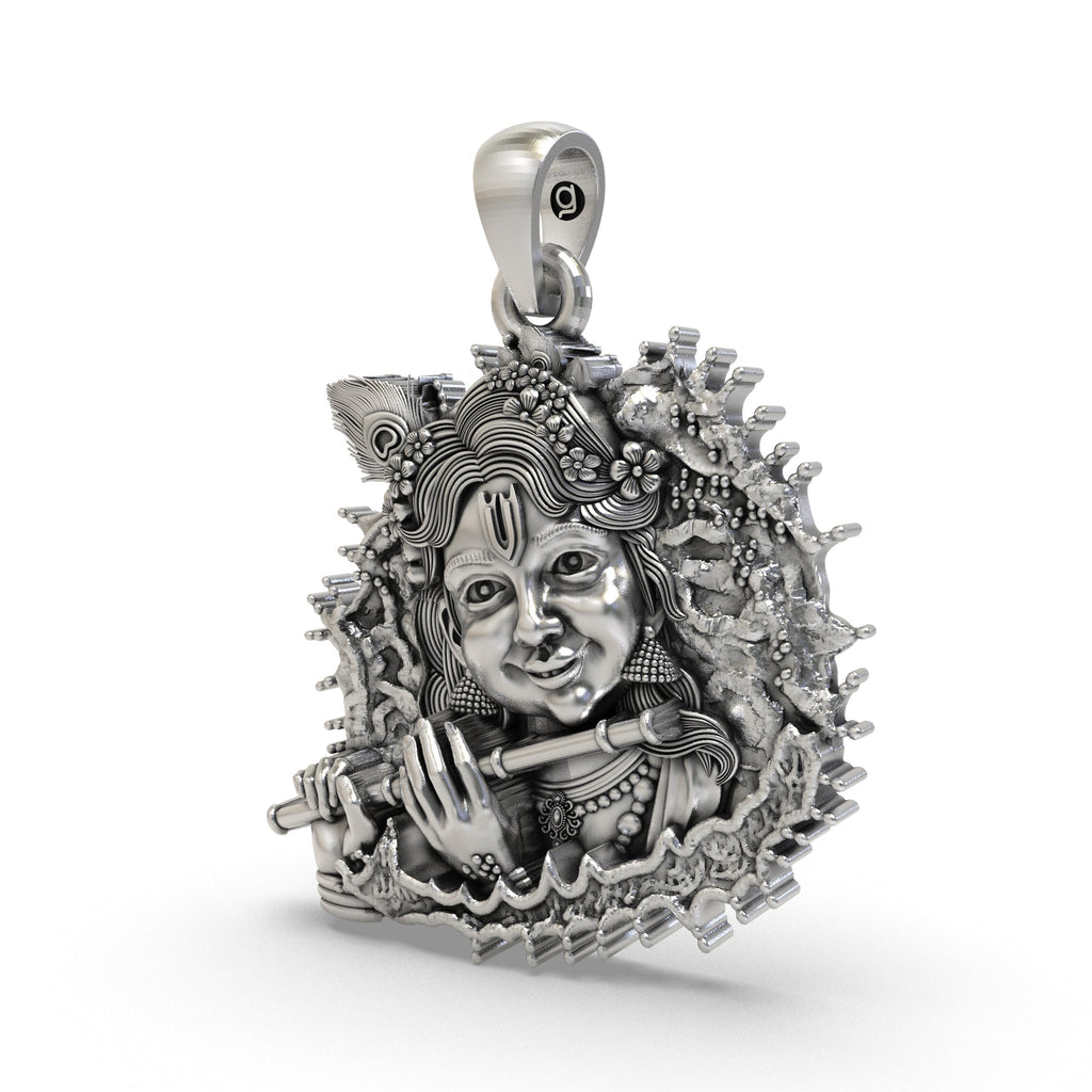 Close-up detail of the handcrafted Bal Krishna silver pendant highlighting the divine flute design.