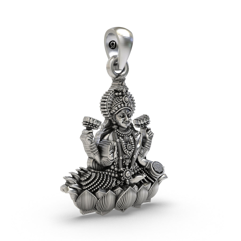 Close-up detail of the Goddess Lakshmi's face on the handmade silver lotus pendant, a piece of Hindu spiritual jewelry.