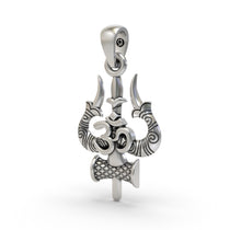 Close-up detail of the oxidized finish on the handcrafted silver Trishul Om Damru temple pendant.