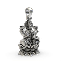 Side angle of the traditional silver temple jewelry Goddess Lakshmi pendant showing kalash details.