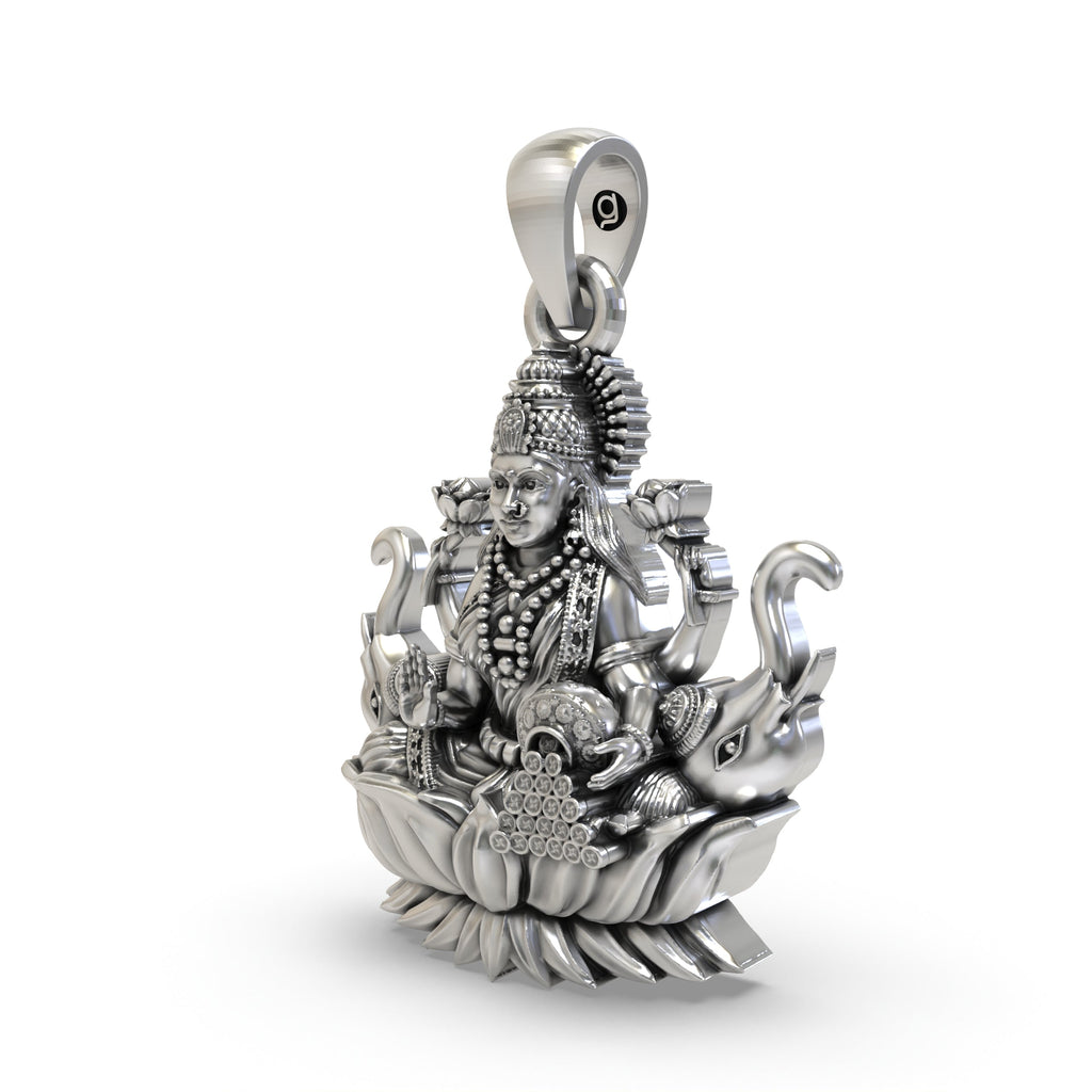 Close-up detail of the handcrafted silver Gajalakshmi pendant showing intricate elephants and coins.